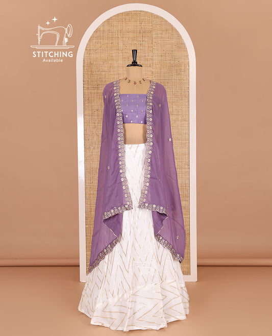 Cream-lavender half-saree, gold chevron striped nylon viscose crepe skirt, contrast diamond buttas blouse, and  a contrast scallop floral-theme embroidered dhavani