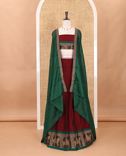 Maroon with green mercedised cotton half-saree, contrast elephant zari border skirt, matching blouse & one side border georgette dhavani