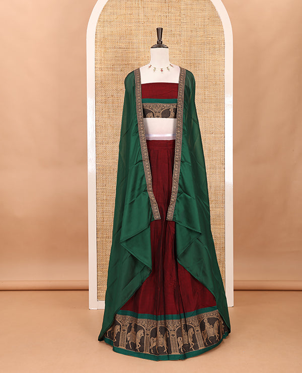 Maroon with green mercedised cotton half-saree, contrast elephant zari border skirt, matching blouse & one side border georgette dhavani