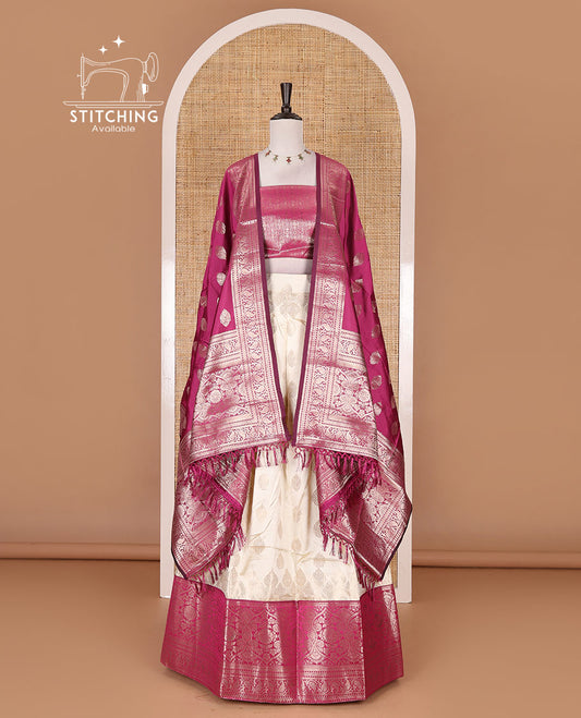 Cream with magenta semi-banarasi half-saree, zari buttas with contrast traditional zari border skirt, zari jacquard blouse, and zari design dhavani