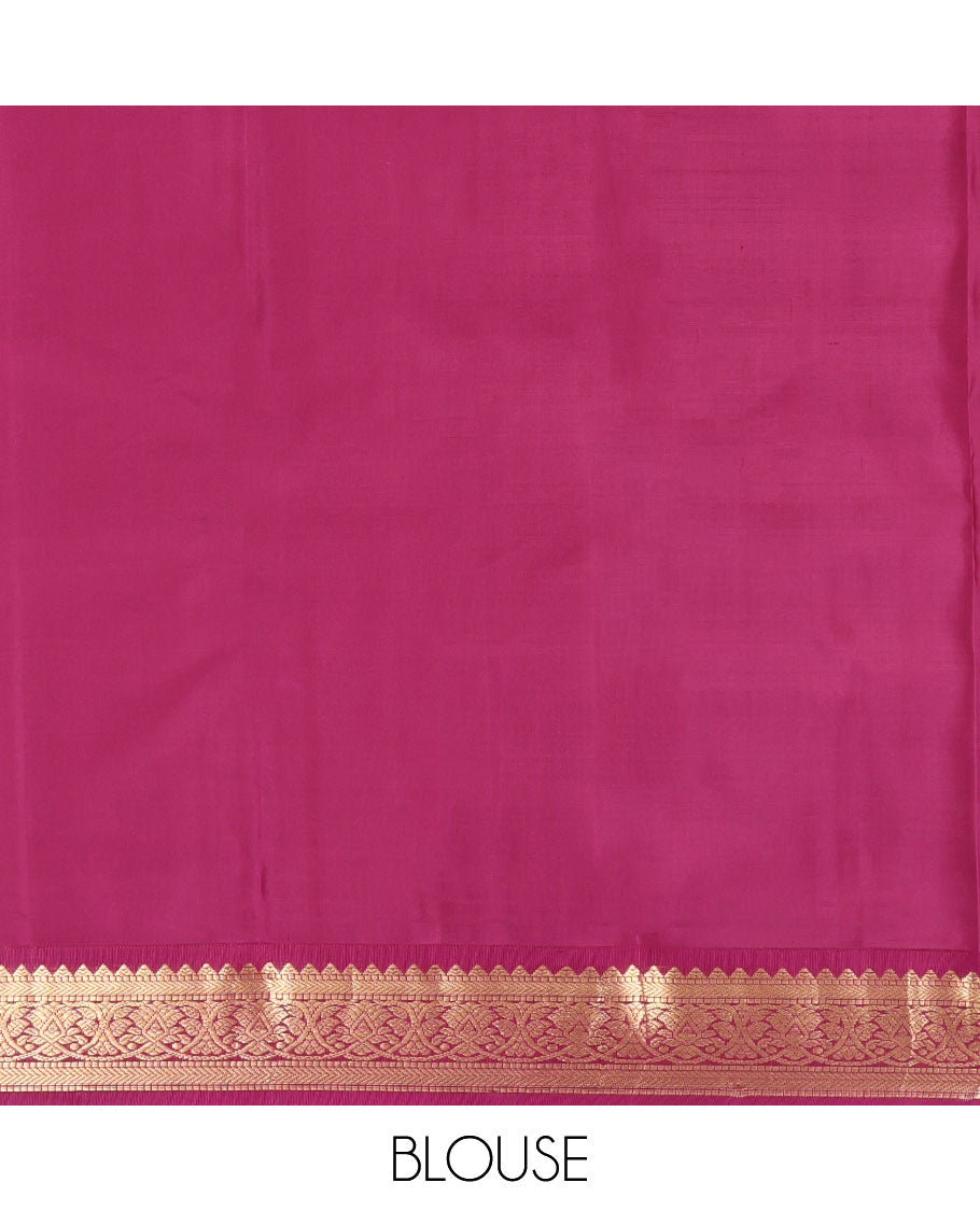 Orange Kanchipuram Silk Saree, Decked Up with Iruthalai Pakshi Buttas on Its Body, Complemented by a Contrast Border of Rekku, Muthu, and Kathir Designs, Grand Jaal Pallu, and Paired with a Contrast Blouse