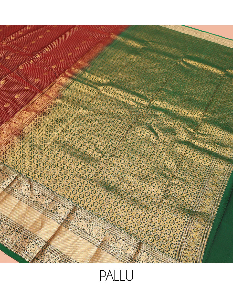Brown Vasundhara Lite Silk Mix Saree, Meticulously Crafted with Zari Buttas and Checks On Its Body, Complemented by Contrast Border of Thilakam Mokku, Muthu, Banaras, Mayil, and Mayil Kann Designs, Grandly Decked Up Pallu and Paired with a Contrast Blouse