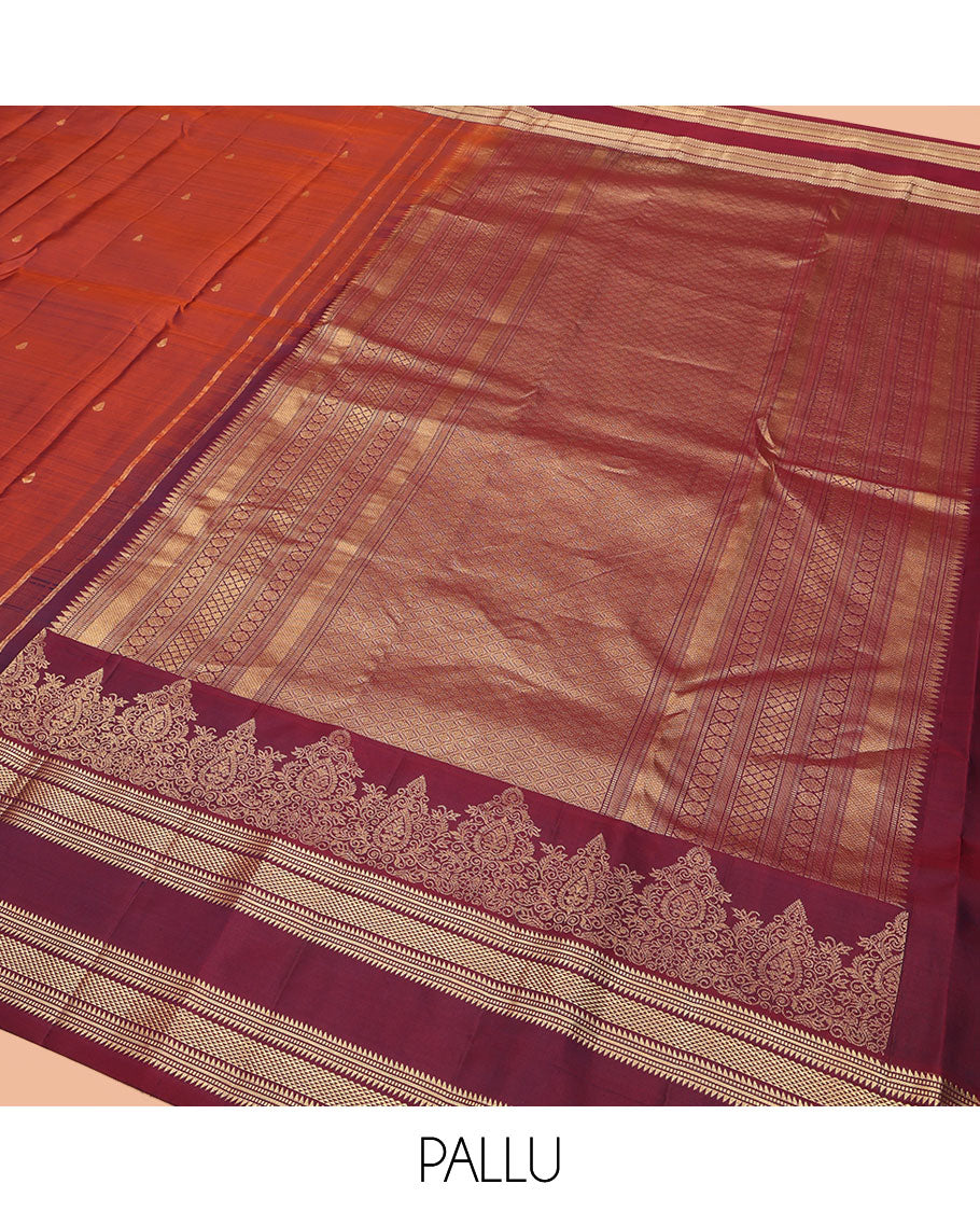 Rust Orange Vasundhara Silk Saree, Enriched with Zari Buttas All Over Its Body, Complemented by a Contrast Rettai Pettu Border of Ara Bogudi, Banaras, Muthu, and Ara Maadam Designs, Grand Jaal Pallu, and Paired with a Contrast Blouse