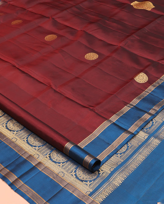 Maroon Mayuri Lite Silk Mix Saree, Gracefully Embellished with Zari Buttas, a Contrast Zari Border, Intricate Pallu, and a Contrast Blouse