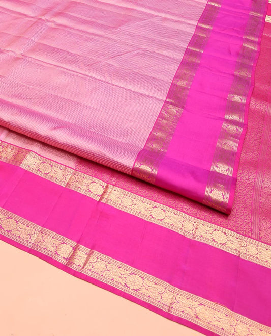 Pink Vasundhara Silk Saree, Subtly Sparkled with Micro-Checks on Its Body, Complemented by Contrast Rettai Pettu Border of Banaras, Muthu, and Jada Nagam Designs, Geometric-Patterned Pallu, and Paired with a Contrast Blouse