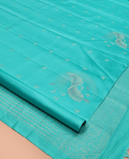 Borderless Blue Mayuri Soft Silk Saree, Subtly Woven with Buttas All Over Its Body, Highlighted by Pallu of Sparsely Woven Designs, and Paired with a Matching Blouse