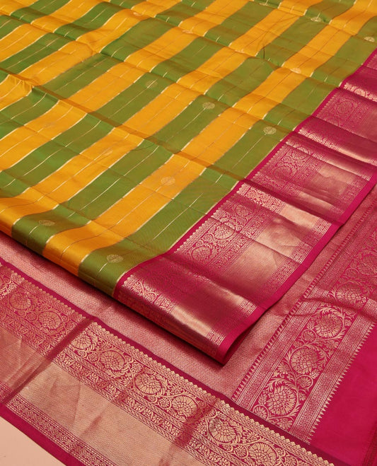 Green-Yellow Vasundhara Silk Saree, Embellished with Zari Buttas and Zari Stripes All Over Its Body, Complemented by a Contrast Border of Thilakam Mokku, Banaras, Muthu, and Kodi Visiry Designs, Pallu of Vanki Designs, and Paired with a Contrast Blouse