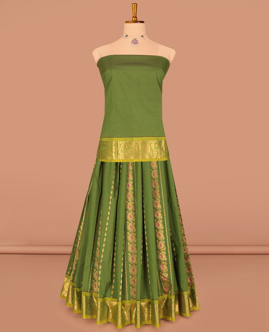 Green Art Silk Pavadai Material Set Featuring Zari Designs on Its Skirt, Complemented by a Contrast Traditional Zari Border, and a Matching Blouse