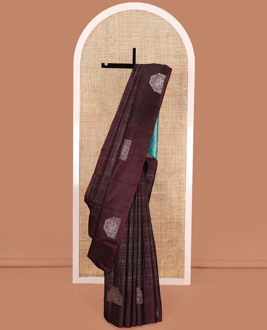 Maroon muthu kattam Kanchipuram silk saree, yaanai motifs zari border, and contrast pallu of yaanai, and chakram buttas