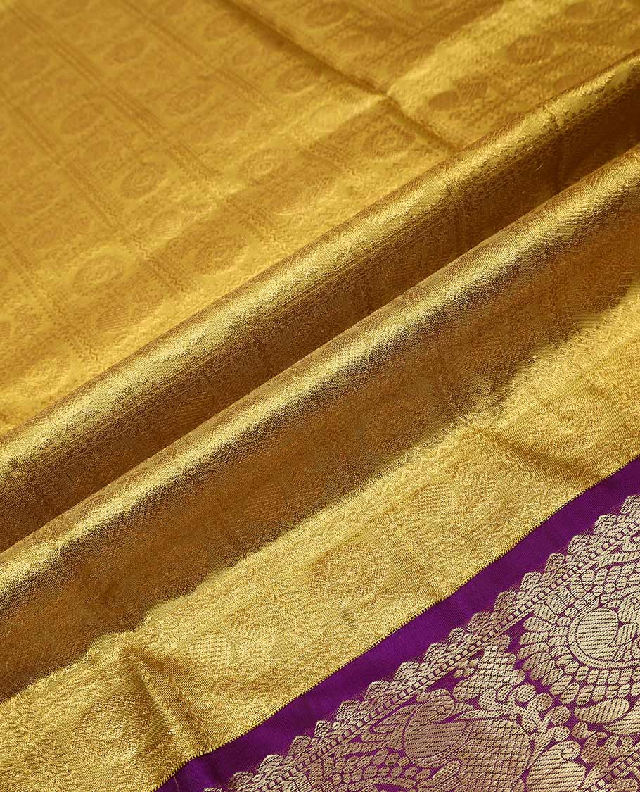 Yellow pure silk half saree, mayil chakram enclosed checked skirt, contrast border of thilakam mokku, muthu, mayil, rudraksham, and mayil kann, jacquard blouse, and zari design dhavani