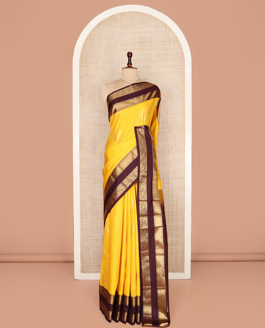 Yellow Budget Silk Saree, Embellished with Zari Stripes and Kolam Buttas All Over Its Body, Complemented by a Contrast Traditional Zari Design Rettai Pettu Border, Grand Scallop Design Pallu, and Paired with a Contrast Blouse