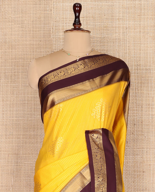Yellow Budget Silk Saree, Embellished with Zari Stripes and Kolam Buttas All Over Its Body, Complemented by a Contrast Traditional Zari Design Rettai Pettu Border, Grand Scallop Design Pallu, and Paired with a Contrast Blouse