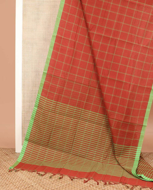 Rust orange checked Mangalagiri cotton saree, contrast striped border, striped pallu, and a contrast floral printed blouse