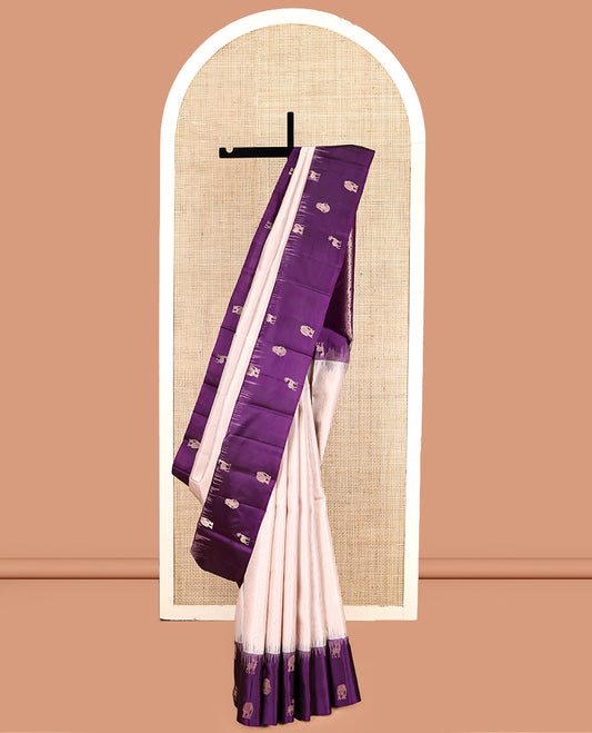 Off-White Kanchipuram Silk Saree, Sparsely Woven with Stripes, Complemented by a Contrast Border Features Yaanai, Maan, and Iruthalai Pakshi, Jaal Pallu, and a Contrast Blouse
