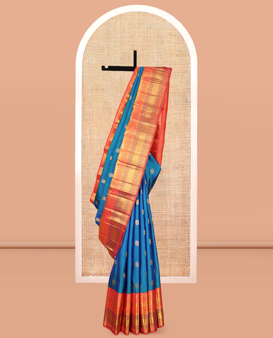 Blue Kanchipuram Silk Saree, Accentuated with Mayil Buttas, a Contrast Korvai Border of Thilakam Mokku, Yaali, Kamalam, Kuyil Kann, Mayil, and Dhavana Kodi, Jaal Pallu, and a Contrast Blouse