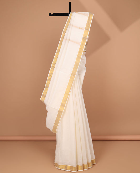 Cream kerala saree with zari stripes, zari border & pallu of floral designs in zari