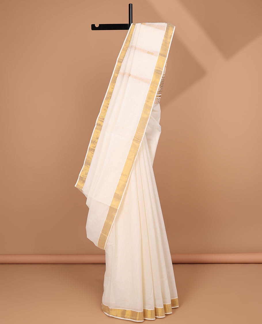 Cream kerala saree with zari stripes, zari border & pallu of floral designs in zari