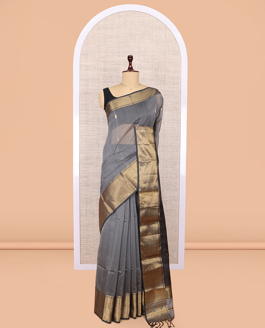 Grey Maheshwari Cotton Saree, Adorned with Buttas, Highlighted by a Traditional Zari Border, Pallu Gleamed Up with Zari Buttas, and a Contrast Blouse