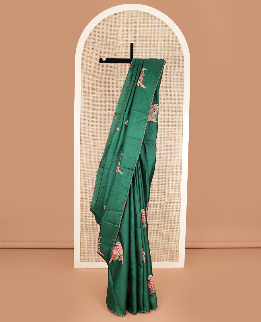 Borderless dark green macaw parrot motifs multi-colored thread embroidered tussar saree