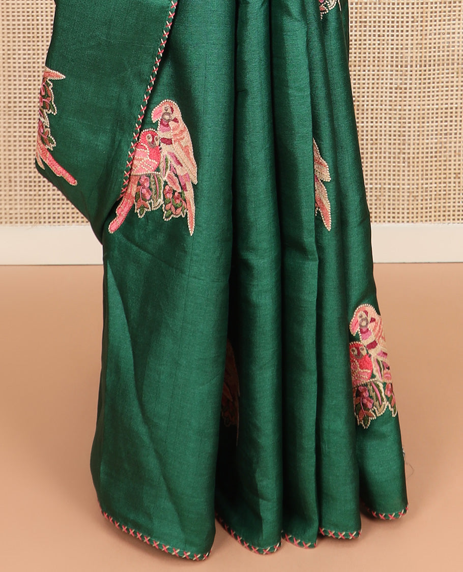 Borderless dark green macaw parrot motifs multi-colored thread embroidered tussar saree