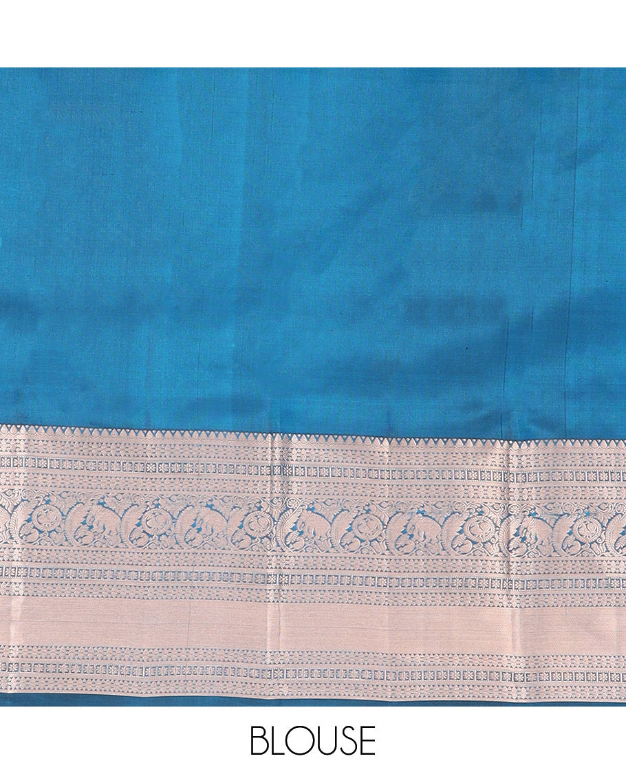 Blue Kanchipuram Wedding Silk Saree Gracefully Embellished with Zari Buttas, Highlighted with Zari Border of Thilakam, Star Vanki, Yaanai, and Round Mayil Designs, Majestically Zari-Woven Pallu, and Paired with a Matching Blouse