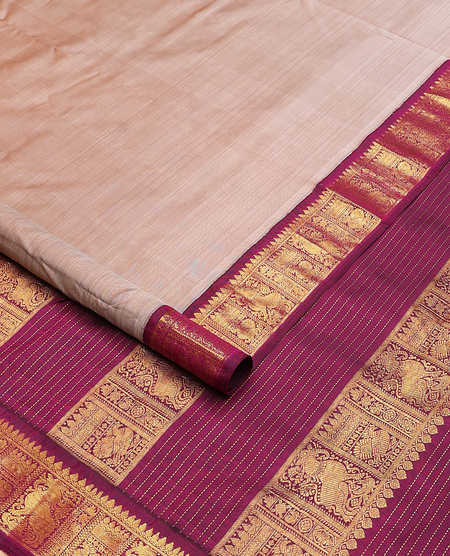 Sandal plain nine-yard silk saree, contrast border of thilakam mokku, neli, mayil and yaali designs, and zari design pallu