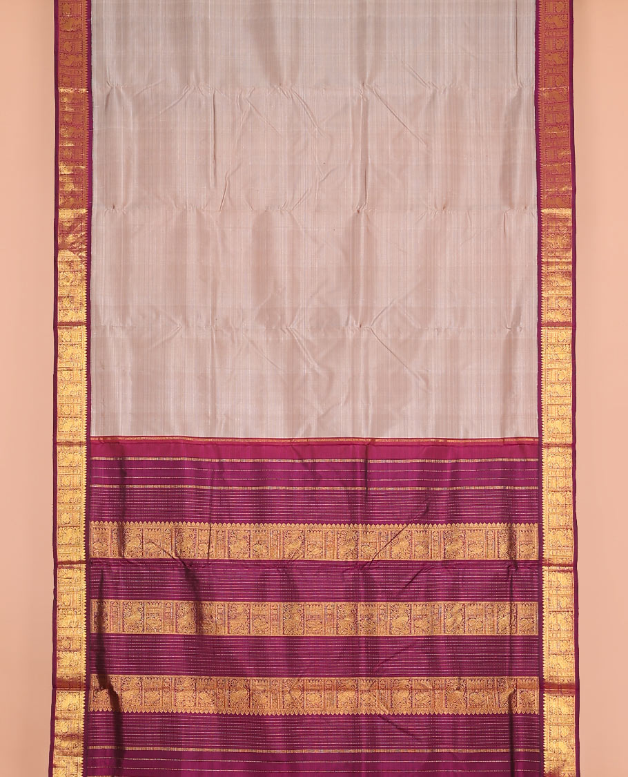 Sandal plain nine-yard silk saree, contrast border of thilakam mokku, neli, mayil and yaali designs, and zari design pallu