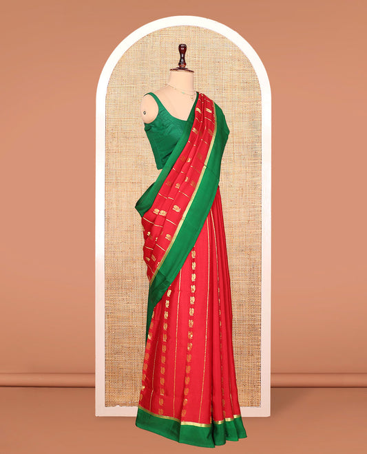 Red Mysore Silk Saree, Gracefully Adorned with Peacock Buttas and Stripes Across Its Body, Complemented by Contrast Border, Pallu Steeped with Traditional Zari Designs, and Paired with a Contrast Blouse