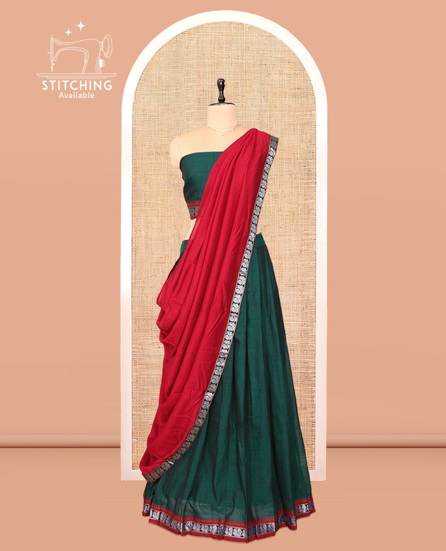 Green Cotton Half-Saree Features Plain Skirt, a Contrast Peacock Border, a Matching Blouse, and a Contrast Red Dhavani