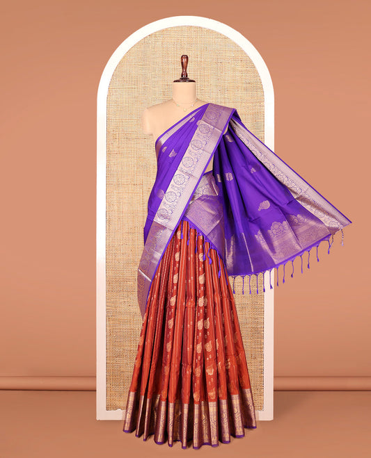 Rust Art Silk Material Half Saree Set, Highlighted by Zari Buttas and Stripes on Its Skirt, Complemented by a Contrast Traditional Zari Design Border, Paired with a Contrast Blouse, and Intricately Designed Dhavani