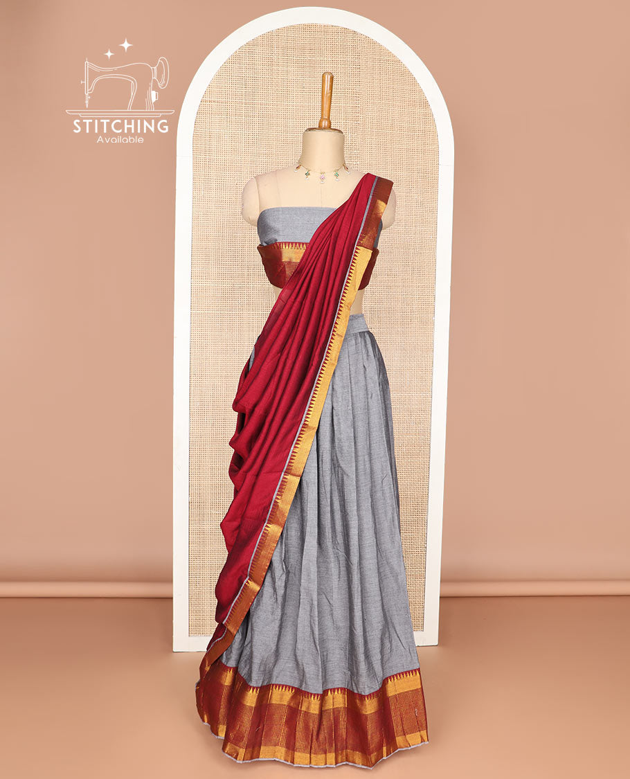 Grey cotton half saree with contrast checked, temple border, zari design blouse & temple border dhavani
