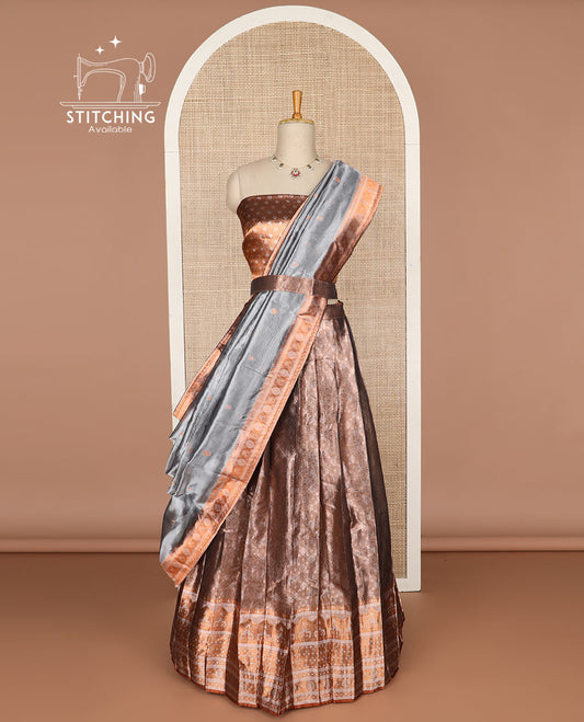 Dark brown floral buttas tissue half saree with contrast zari design border, floral design blouse & floral design dhavani