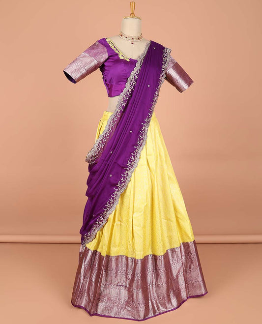 Yellow  floral jacquard semi-stitched half saree with contrast zari border,  embroidered blouse & scallop border dhavani
