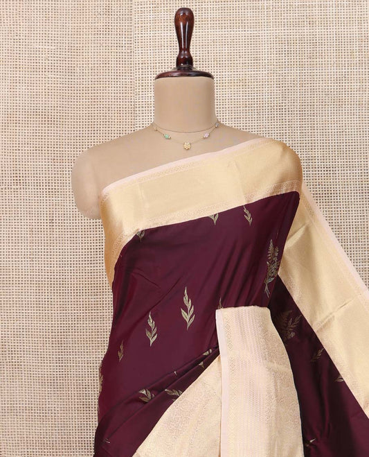 Maroon Budget Silk Saree, Mesmerized with Floral Zari Buttas All Over Its Body, Complemented by Contrast Traditional Zari Design Border, Grandly Woven Pallu of Floral Jaal Designs, and Paired with a Contrast Blouse