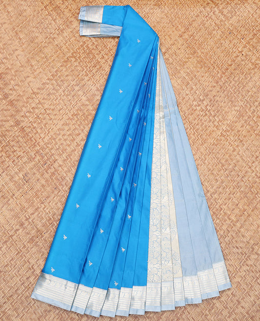Blue Budget Silk Saree, Embellished with Zari Buttas All Over Its Body, Complemented by a Contrast Traditional Zari Design Border, Mughal-Style Floral Designs Pallu, and Paired with a Contrast Blouse