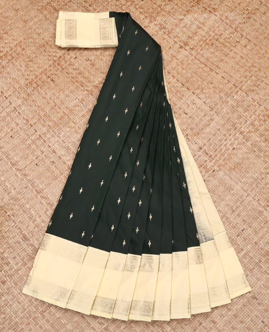 Deep Green Budget Silk Saree, Accentuated with Zari Buttas on Its Body, Complemented by a Contrast Traditional Zari Design Rettai Pettu Border, Sparsely Woven Pallu, and Paired with a Contrast Blouse