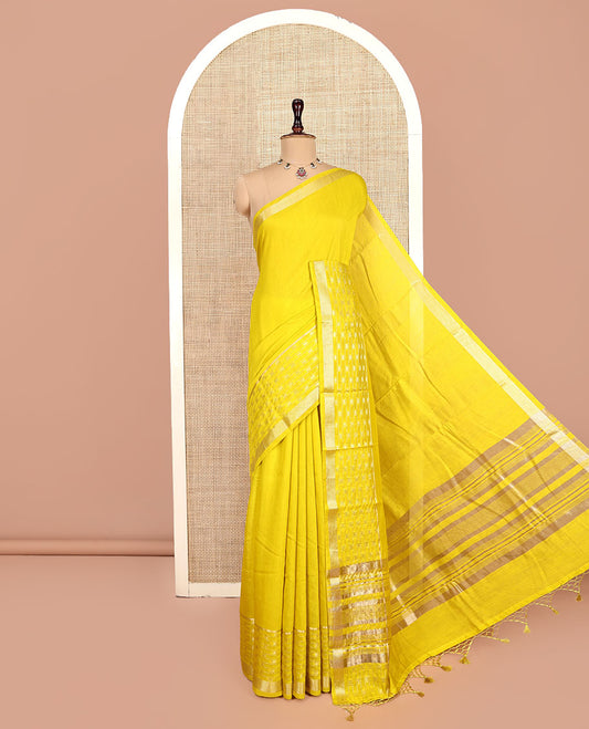 Yellow Plain Assam Silk Saree, Highlighted by a Traditional Zari Border, Zari-Striped Pallu, and a Matching Blouse