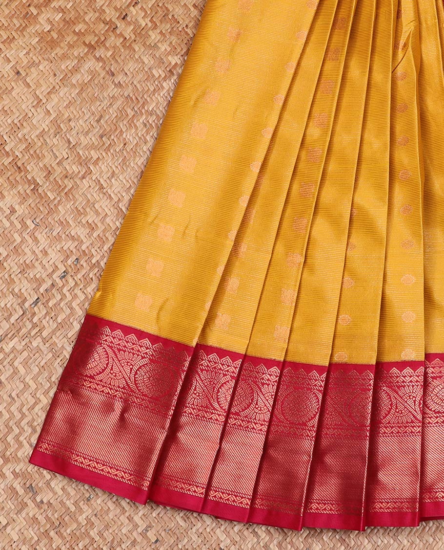 Yellow striped and peacock chakra buttas gift saree, contrast traditional zari design border, and jaal pallu
