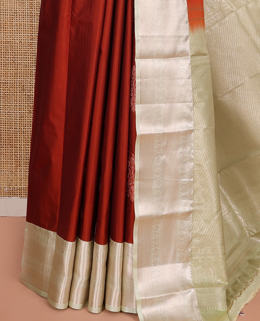 Rust Orange Budget Silk Saree, Ornamented with Zari Buttas All Over Its Body, Complemented by a Contrast Border of Traditional Zari Designs, Intricately Designed Pallu, and Paired with a Contrast Blouse