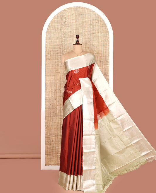 Rust Orange Budget Silk Saree, Ornamented with Zari Buttas All Over Its Body, Complemented by a Contrast Border of Traditional Zari Designs, Intricately Designed Pallu, and Paired with a Contrast Blouse