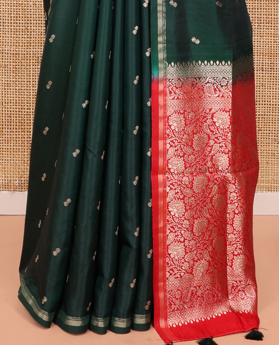 Bottle Green Satin Silk Saree, Enriched with Buttas All Over Its Body, a Subtle Piping Border, Complemented by a Contrast Pallu of Floral-Paisley Designs in Zari, and Paired with a Contrast Blouse