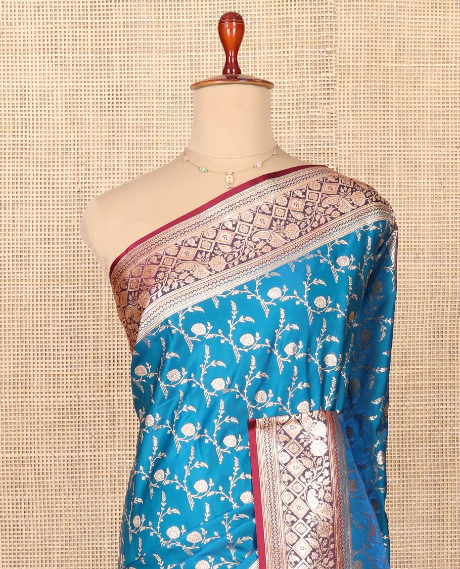 Blue Semi-Banaras Saree, Mesmerized with Jaal Jacquard on Its Body, Complemented by a Contrast Floral, Paisley, and Geometric Design Border, Intricately Designed Pallu, and Paired with a Contrast Blouse