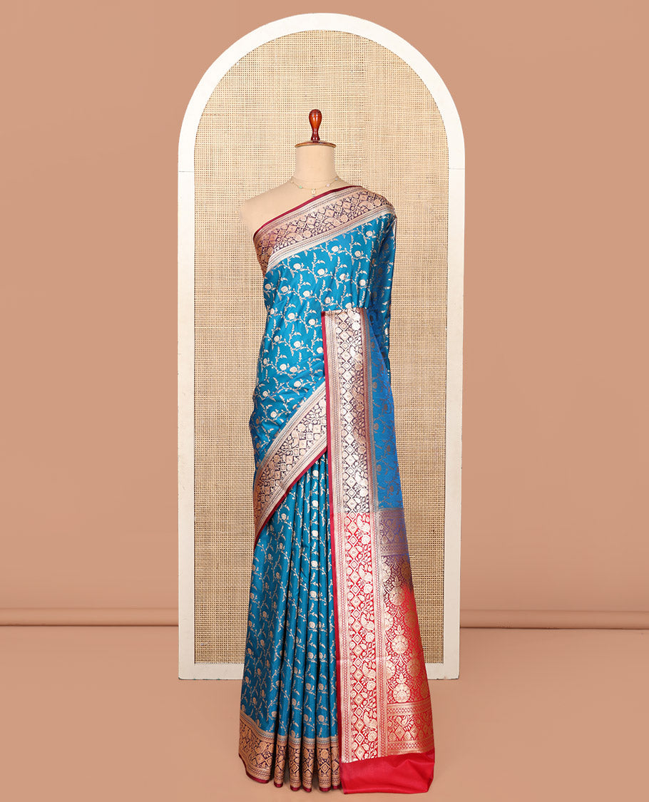 Blue Semi-Banaras Saree, Mesmerized with Jaal Jacquard on Its Body, Complemented by a Contrast Floral, Paisley, and Geometric Design Border, Intricately Designed Pallu, and Paired with a Contrast Blouse