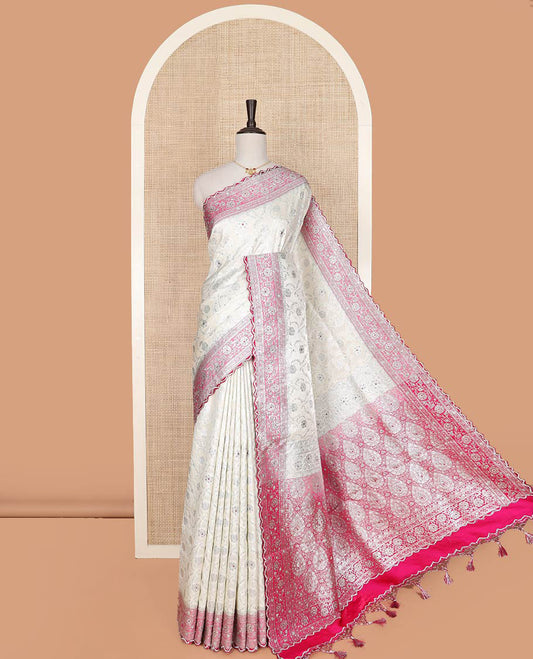 Pearl white floral jaal jacquard banarasi silk saree, contrast floral creeper stone work border, and pallu of intricate designs and stone work