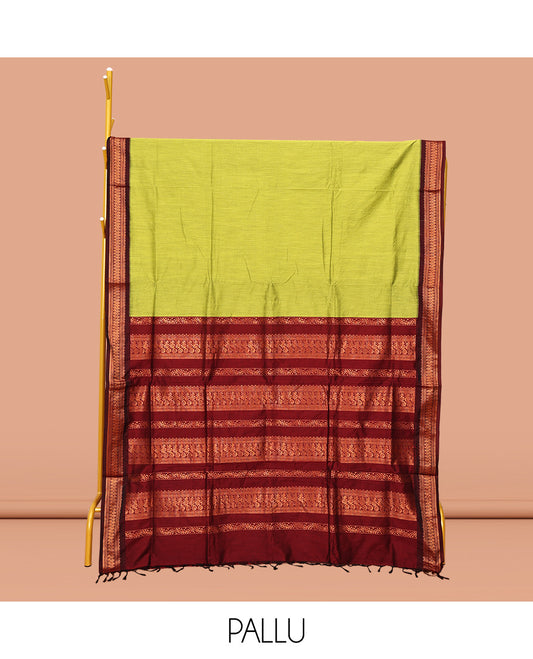 Green Plain Kalyani Cotton Saree, Complemented by a Contrast Traditional Zari Design Border, Pallu Features Traditional Zari Designs, and Paired with a Contrast Blouse