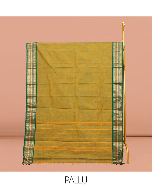 Green Chettinad Cotton Saree, Subtly Woven with Thread Buttas All Over Its Body, Complemented by Contrast Traditional Zari Design Border, Pallu of Stripes, and Buttas and Paired with a Matching Blouse