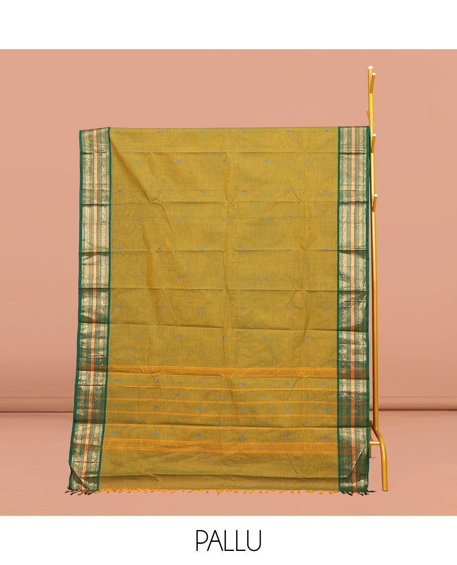 Green Chettinad Cotton Saree, Subtly Woven with Thread Buttas All Over Its Body, Complemented by Contrast Traditional Zari Design Border, Pallu of Stripes, and Buttas and Paired with a Matching Blouse
