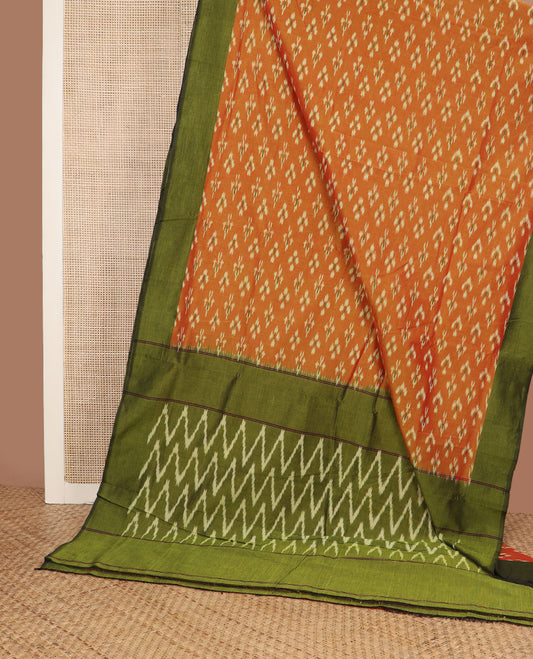 Orange buttas ikkat cotton saree, contrast plain border & pallu of ikkat chevron design