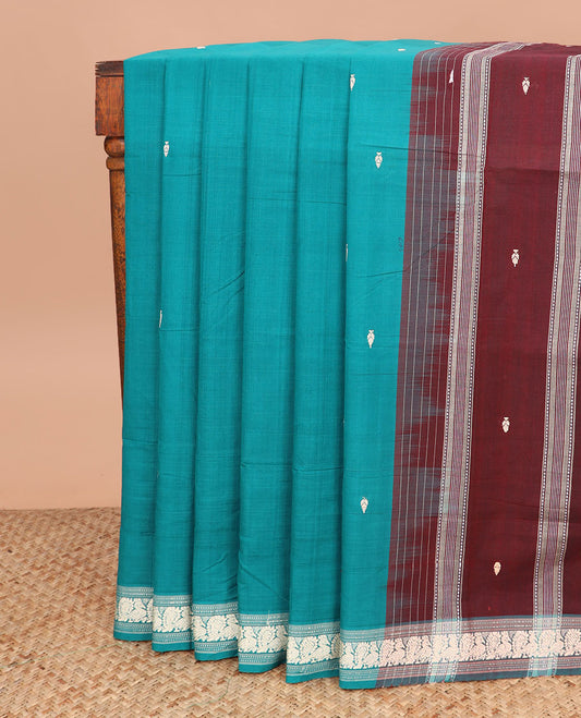 Blue buttas Andhra cotton saree, peacock motifs border, and contrast pallu of stripes and buttas