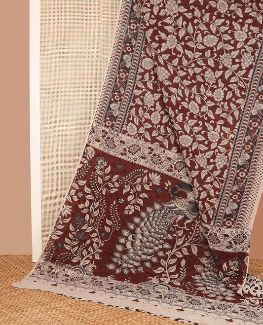 Maroon floral vine machine-printed kalamkari cotton saree, flora-geometric printed border, and pallu of floral vine and peacock print